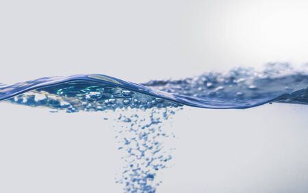 Water splash with bubbles of air, isolated on the white background.