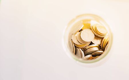 Money Coins stacked on each other in different positions.の写真素材