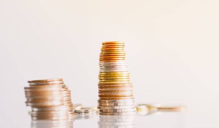Money Coins stacked on each other in different positions.の写真素材