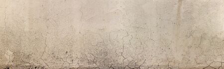 Old Wall with Moldy Peeling White Painting from Humidity. Cracked White Wall as Rusty Concrete Weathered Wall Grunge Background or Abstract Backdrop Wallpaper Vintage Texture Design Copy Space Textの写真素材