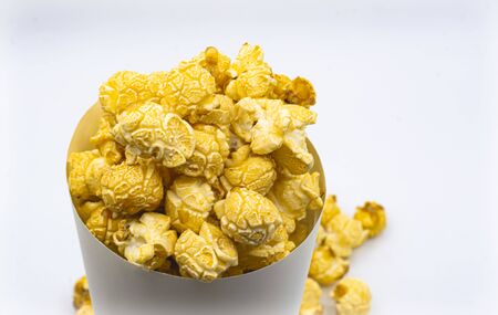 paper bucket of popcorn on white color backgroundの写真素材