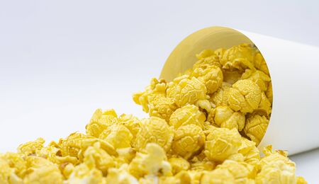 paper bucket of popcorn on white color backgroundの写真素材
