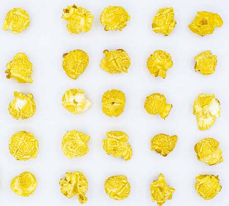 Delicious popcorn with caramel in bowl on
white color background, top viewの写真素材
