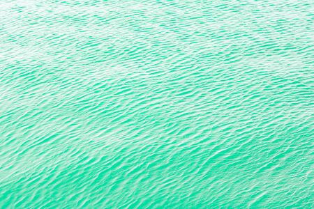 Bright blue  green Tones Water Waves Surface as Backgroundの写真素材