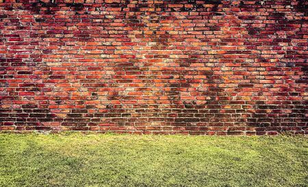 Empty Old Brick Wall Texture. Painted Distressed Wall Surface. Grungy Wide Brickwall. Grunge Red Stonewall Background. Shabby Building Facade With Damaged Plaster. Abstract Web Banner. Copy Space.の写真素材