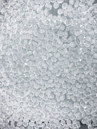 Polypropylene granule close-up background texture.