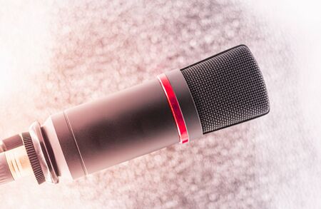 Sound studio. Microphone with cable isolated on bright  backgroundの写真素材