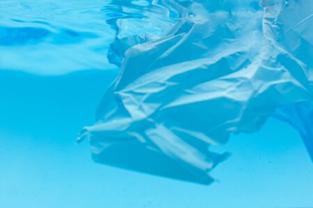 Environmental problems of plastic pollution in the beautiful blue oceanの写真素材