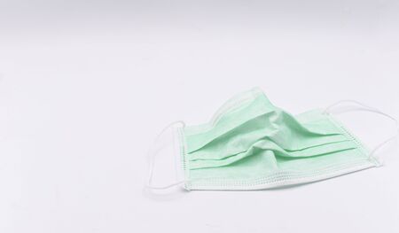 Anti-virus and dust mask that has been used on a white background.の写真素材