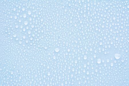 Structural glass with small water droplets in blue colorの写真素材