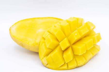 Yellow  mango slice with cubes isolated white backgroundの写真素材