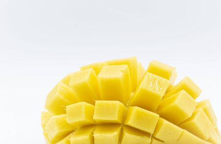 Yellow  mango slice with cubes isolated white background