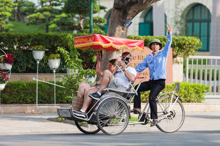 Hanoi, Vietnam - Feb 27, 2020: Hanoi old quarter main square, rickshaw drivers carrying tourists around town.のeditorial素材