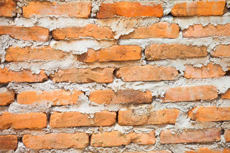 old brick wall with white and red bricks background. vintage brick wall textureの写真素材