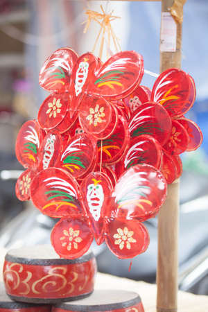 Traditional market sells colorful lanterns with different shapes, lion heads, drums... for the mid-autumn festival. The market is organized at Old Quarter, Hanoi.の写真素材