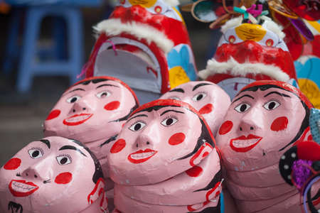 Traditional market sells colorful lanterns with different shapes, lion heads, drums... for the mid-autumn festival. The market is organized at Old Quarter, Hanoi.の写真素材