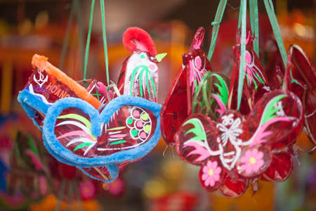 Traditional market sells colorful lanterns with different shapes, lion heads, drums... for the mid-autumn festival. The market is organized at Old Quarter, Hanoi.の写真素材