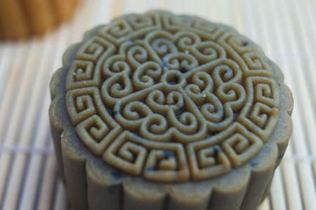 Vietnamese mid autumn festival cake. Mooncakes are traditional pastries eaten during the Mid-Autumn Festival. The festival involves family getting together to share mooncakes while watching the moonの写真素材