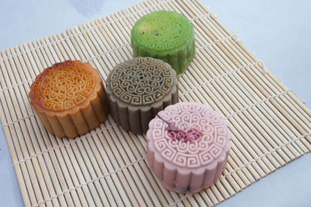 Vietnamese mid autumn festival cake. Mooncakes are traditional pastries eaten during the Mid-Autumn Festival. The festival involves family getting together to share mooncakes while watching the moonの写真素材