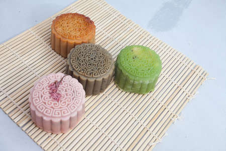 Vietnamese mid autumn festival cake. Mooncakes are traditional pastries eaten during the Mid-Autumn Festival. The festival involves family getting together to share mooncakes while watching the moonの写真素材