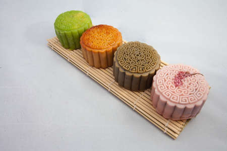 Vietnamese mid autumn festival cake. Mooncakes are traditional pastries eaten during the Mid-Autumn Festival. The festival involves family getting together to share mooncakes while watching the moonの写真素材