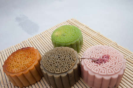 Vietnamese mid autumn festival cake. Mooncakes are traditional pastries eaten during the Mid-Autumn Festival. The festival involves family getting together to share mooncakes while watching the moonの写真素材