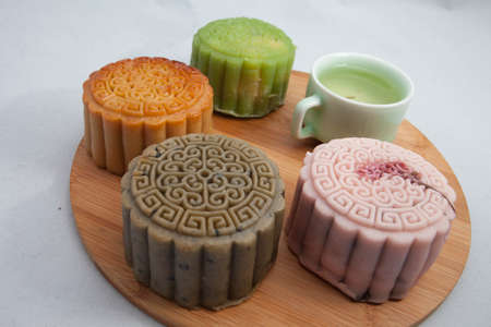 Vietnamese mid autumn festival cake. Mooncakes are traditional pastries eaten during the Mid-Autumn Festival. The festival involves family getting together to share mooncakes while watching the moonの写真素材