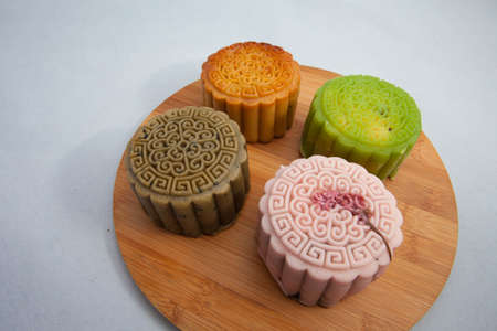 Vietnamese mid autumn festival cake. Mooncakes are traditional pastries eaten during the Mid-Autumn Festival. The festival involves family getting together to share mooncakes while watching the moonの写真素材
