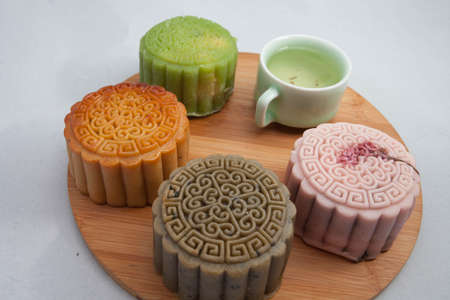 Vietnamese mid autumn festival cake. Mooncakes are traditional pastries eaten during the Mid-Autumn Festival. The festival involves family getting together to share mooncakes while watching the moonの写真素材
