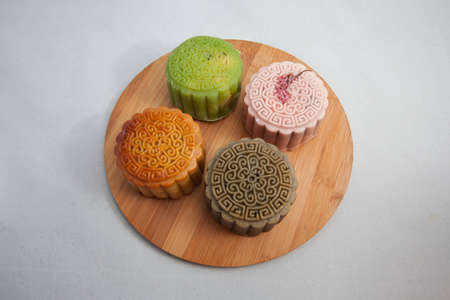 Vietnamese mid autumn festival cake. Mooncakes are traditional pastries eaten during the Mid-Autumn Festival. The festival involves family getting together to share mooncakes while watching the moonの写真素材