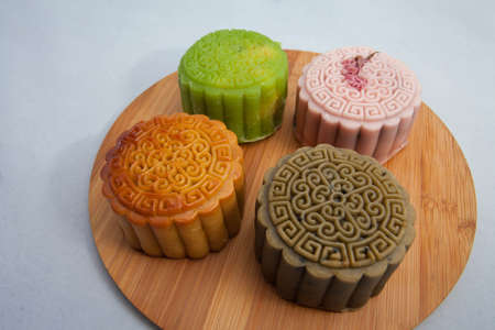 Vietnamese mid autumn festival cake. Mooncakes are traditional pastries eaten during the Mid-Autumn Festival. The festival involves family getting together to share mooncakes while watching the moonの写真素材