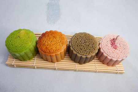 Vietnamese mid autumn festival cake. Mooncakes are traditional pastries eaten during the Mid-Autumn Festival. The festival involves family getting together to share mooncakes while watching the moonの写真素材