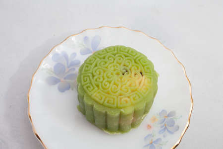 Vietnamese mid autumn festival cake. Mooncakes are traditional pastries eaten during the Mid-Autumn Festival. The festival involves family getting together to share mooncakes while watching the moonの写真素材