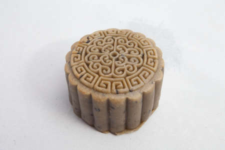 Vietnamese mid autumn festival cake. Mooncakes are traditional pastries eaten during the Mid-Autumn Festival. The festival involves family getting together to share mooncakes while watching the moonの写真素材