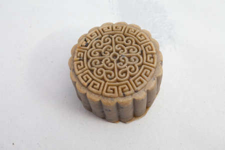 Vietnamese mid autumn festival cake. Mooncakes are traditional pastries eaten during the Mid-Autumn Festival. The festival involves family getting together to share mooncakes while watching the moonの写真素材