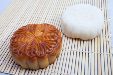 Vietnamese mid autumn festival cake. Mooncakes are traditional pastries eaten during the Mid-Autumn Festival. The festival involves family getting together to share mooncakes while watching the moonの写真素材