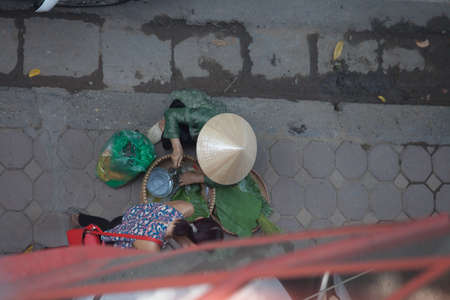 Hanoi, Vietnam, August 23, 2015: Life in Vietnam- Hanoi,Vietnam Street vendors in Hanoi\'s Old Quarterのeditorial素材