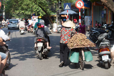 Hanoi, Vietnam, August 23, 2015: Life in Vietnam- Hanoi,Vietnam Street vendors in Hanoi\'s Old Quarterのeditorial素材