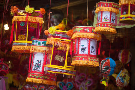 Hanoi / Vietnam - Sept. 1 2020: Traditional market sells colorful lanterns with different shapes, lion heads, drums... for the mid-autumn festival. The market is organized at Old Quarter, Hanoi.のeditorial素材