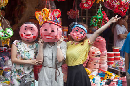 Hanoi / Vietnam - Sept. 1 2020: Traditional market sells colorful lanterns with different shapes, lion heads, drums... for the mid-autumn festival. The market is organized at Old Quarter, Hanoi.のeditorial素材