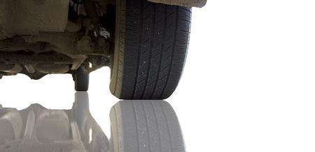 The underside of a truck reflected on a white surface.の写真素材
