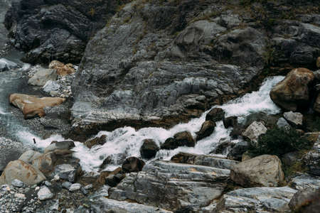 Rocky Waterfall in flowing down into small rocky river, in Hualien Taiwan.の写真素材