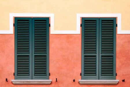 Symmetrical shutters on a building in Desenzano del Garda Italy Europeの写真素材