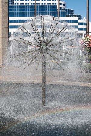 Fountain water feature in Vancouver complete with rainbowの写真素材