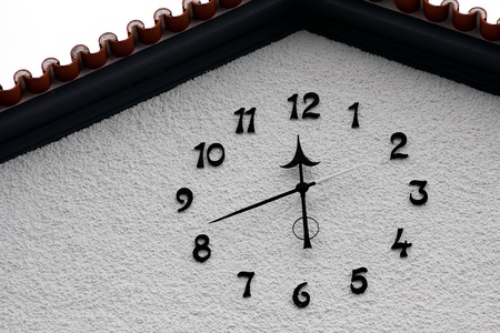 Close-up detail of a clock on a building in Madeira
