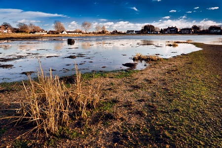 Incoming tide at Bosham harbour West Sussexの写真素材