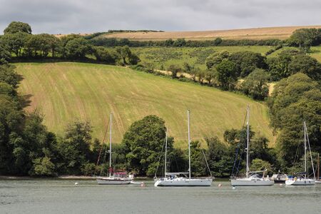 Boats moored on the River Dartのeditorial素材