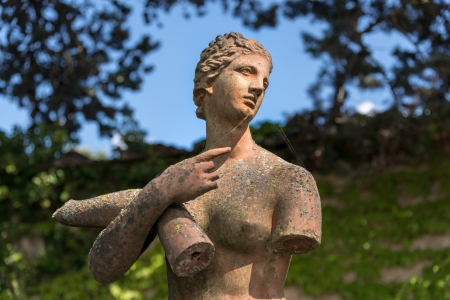 Damaged female statue in the gounds of Palazzo Massainiの写真素材