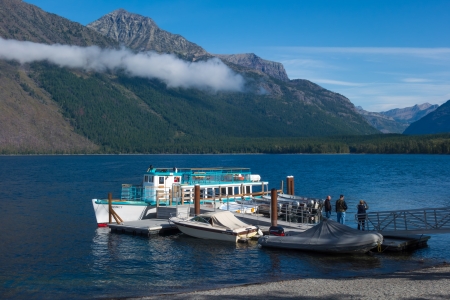 Boats moored to a jetty in Lake McDonaldのeditorial素材