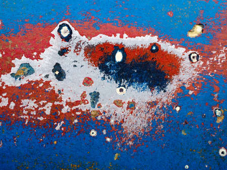 FAVERSHAM, KENT/UK - March 29 : Abstract peeling sanded paintwork on a Fibre glass boat in Faversham...
